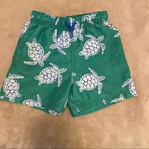 Mini Boden sea turtle swim trunks